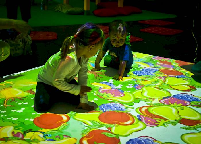 Children playing on interactive floor